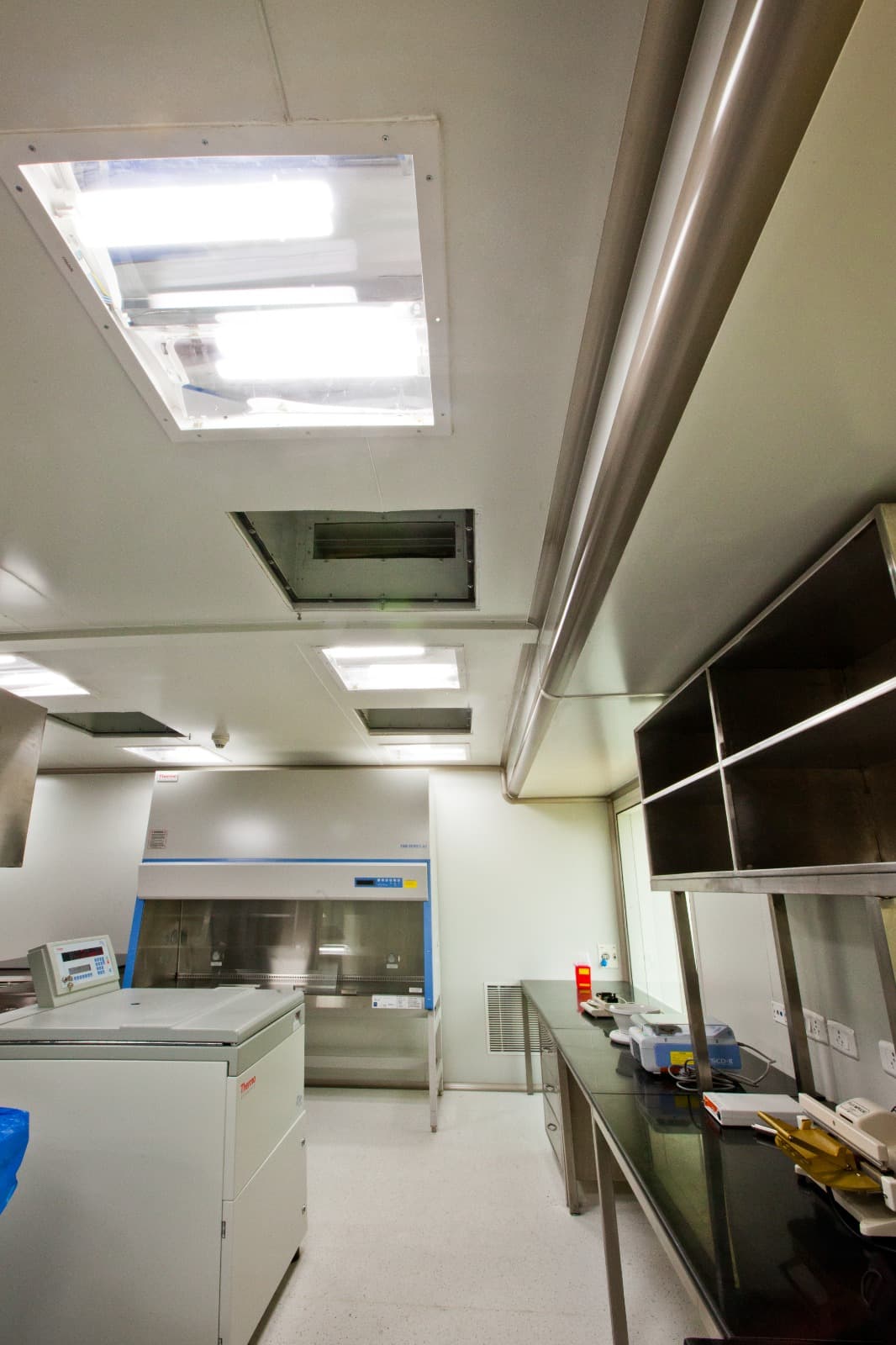 Pharma laboratory cleanroom with biosafety cabinet, laminar airflow hood and terminal HEPA filters