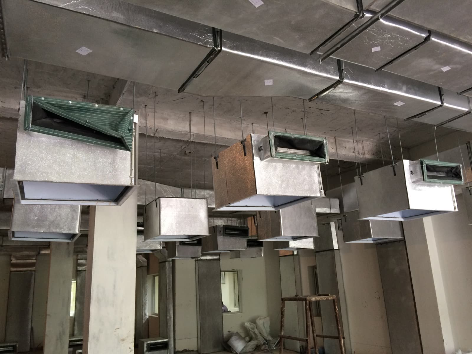 Insulated GI duct branch take-off supported from the soffit