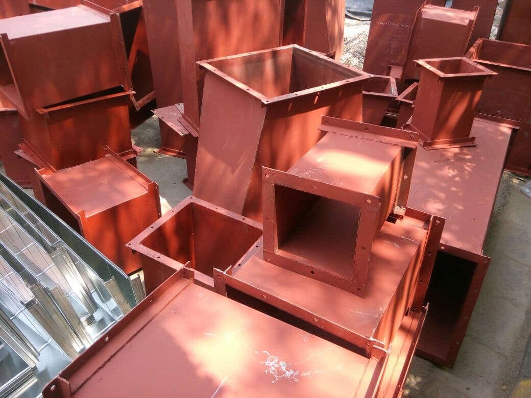 Close-up of red-oxide primed MS rectangular duct fittings and reducers