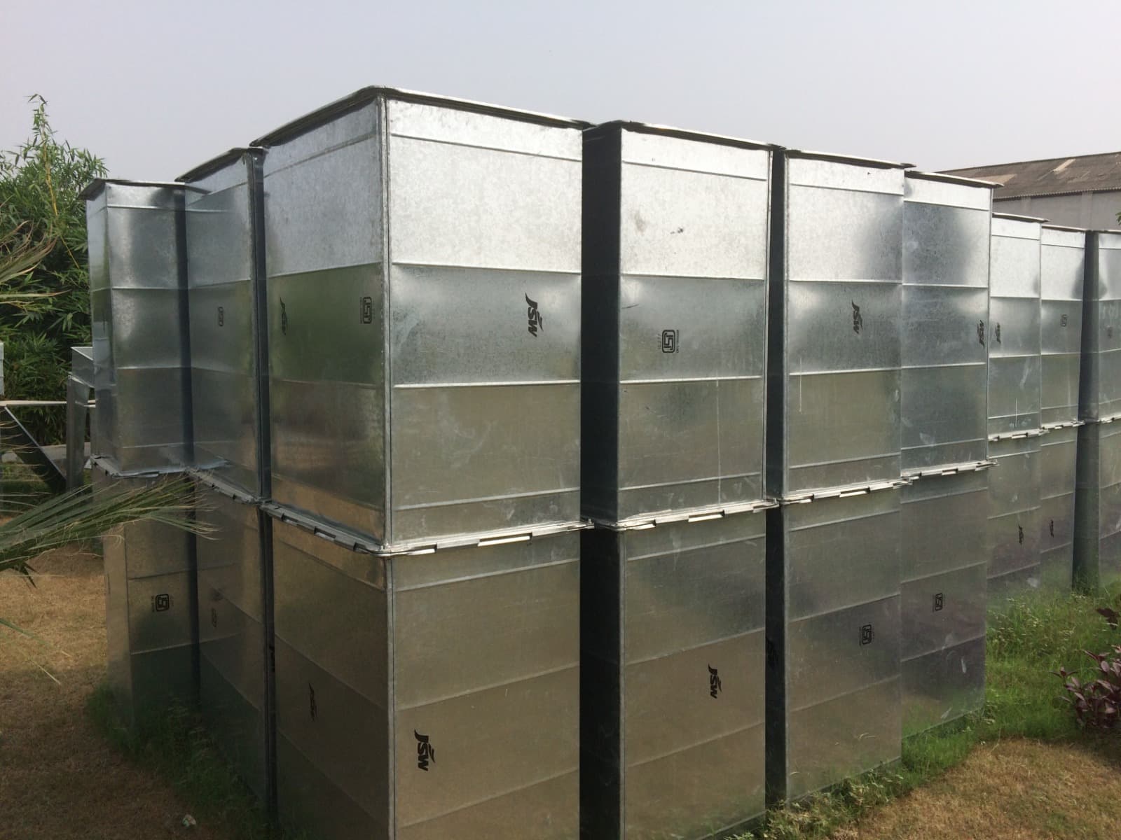 Galvanised rectangular duct sections stacked and ready for dispatch