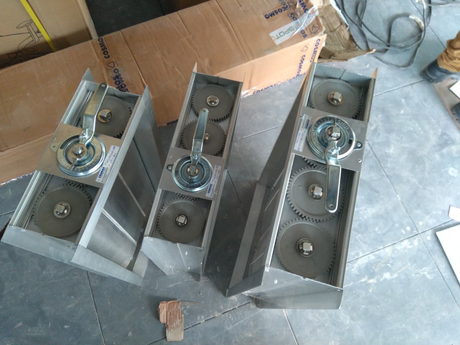 Cosmos volume control dampers with gear-operated quadrants before installation