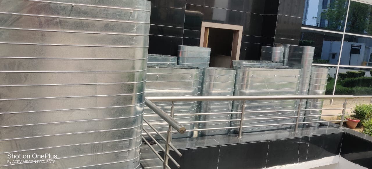 Spiral round and flat-oval GI ducting staged on a terrace