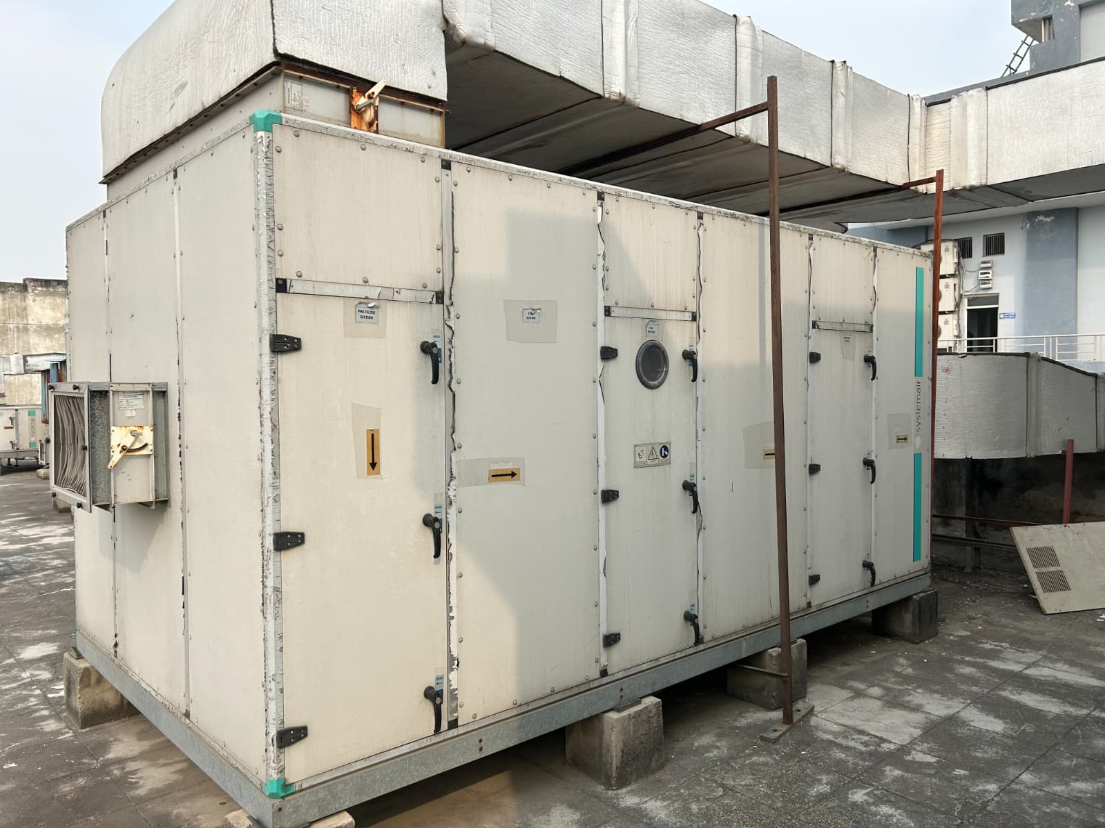 Systemair double-skin air handling unit with insulated supply ducting on a rooftop
