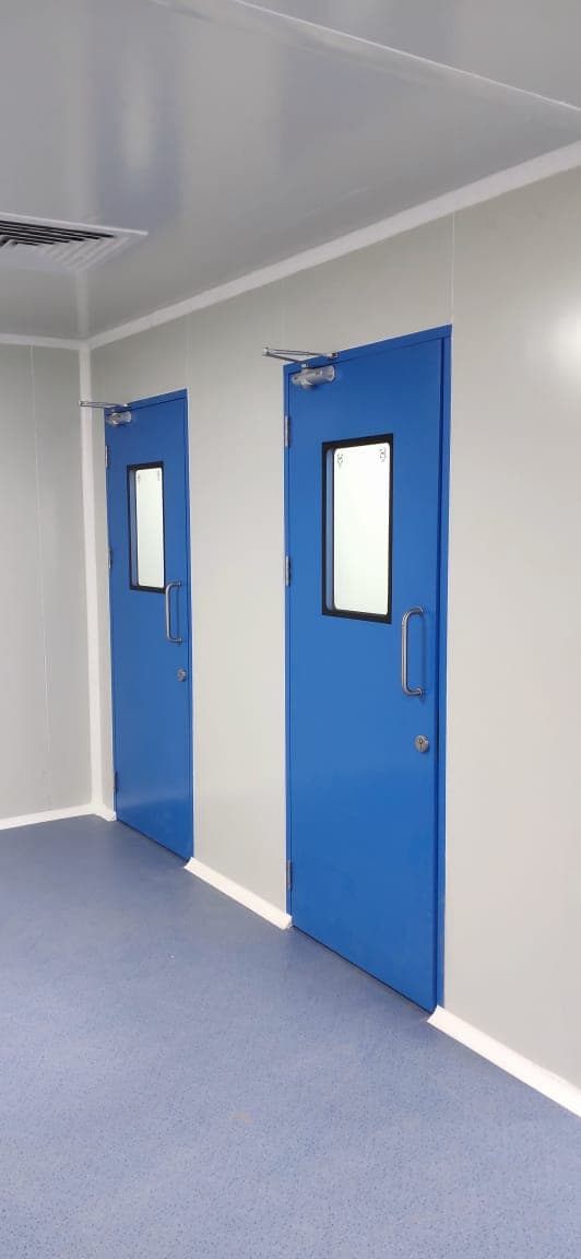 Cleanroom with twin blue GMP doors and blue anti-static vinyl flooring